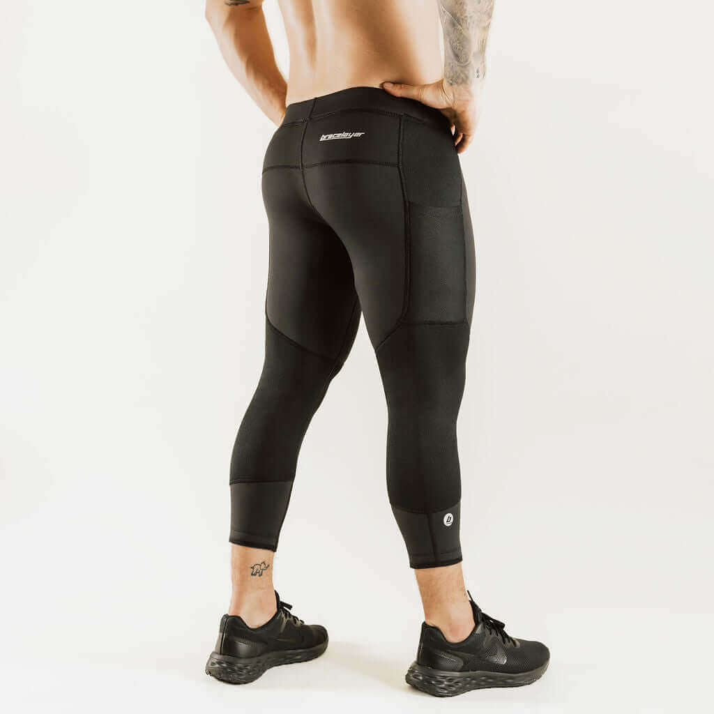 Black 7/8 thermal base layer leggings with rear contour seams and knee support