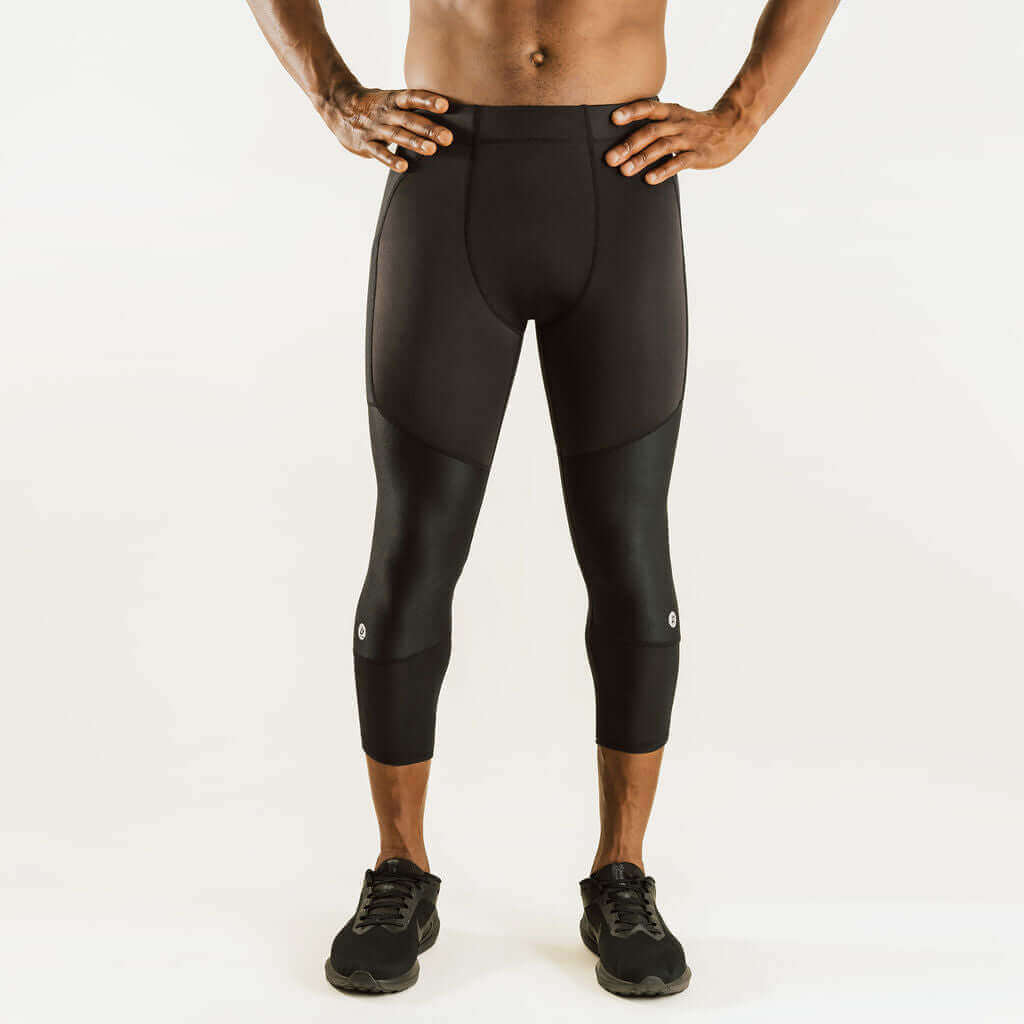 Men's knee support compression pants, 7/8 length, black, full front view with ankle-to-knee fit