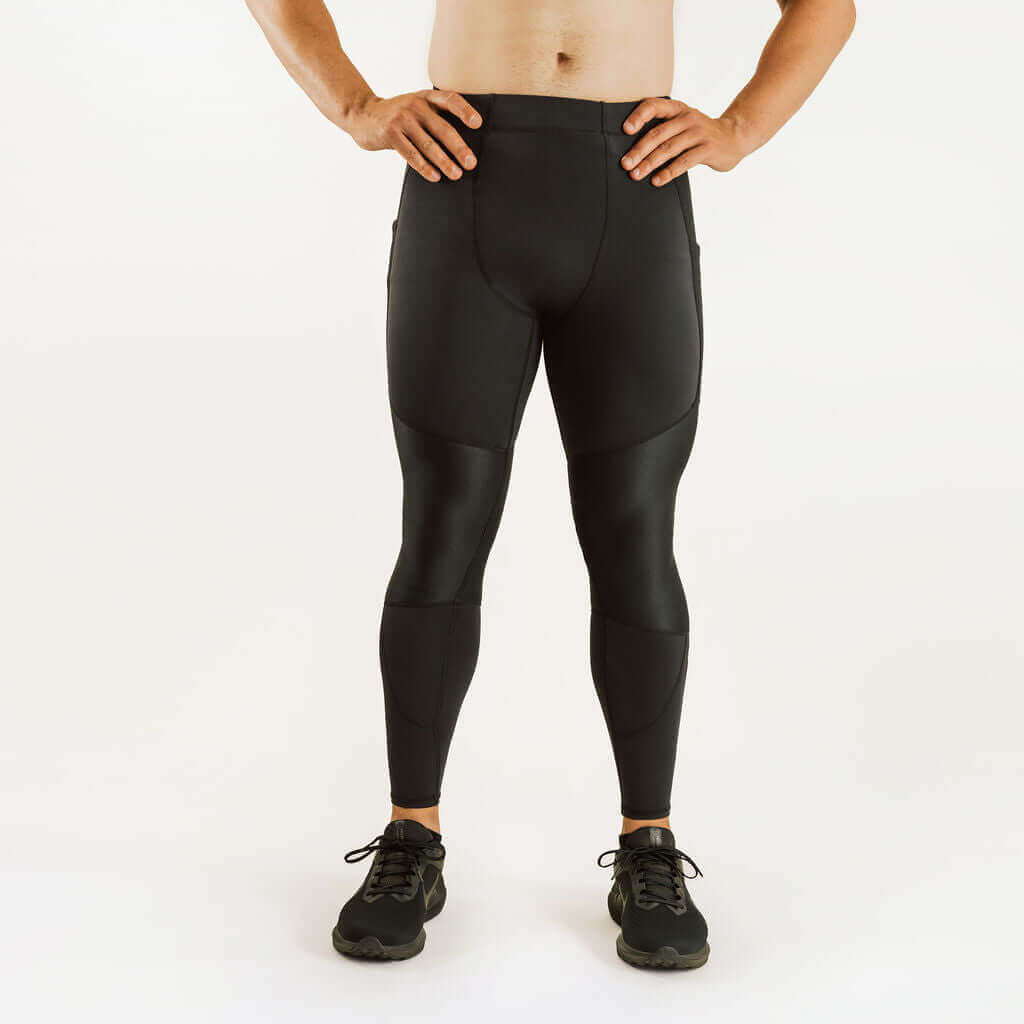 Men's knee support compression pants in dark color with smooth contoured panels
