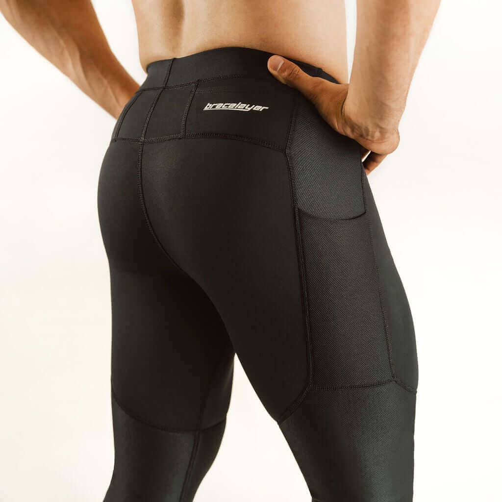 Men's knee support compression pants in dark color with reinforced knee panels