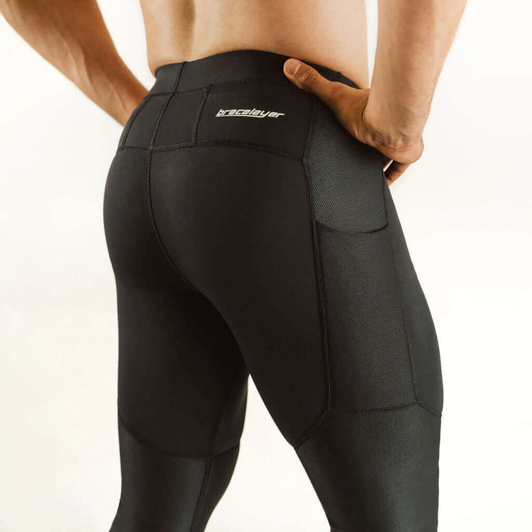 Men's knee support compression pants in dark color with reinforced knee panels