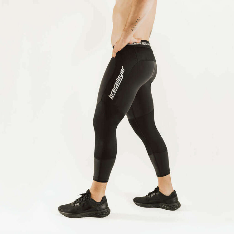 Black thermal leggings with side logo and knee support, 7/8 cuffed hem
