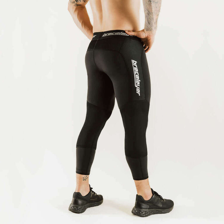 Black knee-support thermal leggings with side logo, full leg view