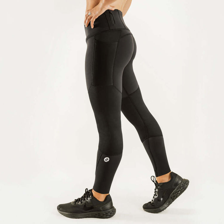 Black knee support compression pants with sculpted knee panels and snug fit.