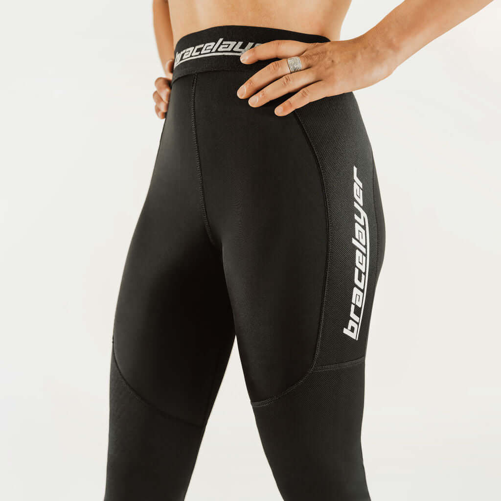 Black thermal base layer leggings with knee support, waistband logo band detail