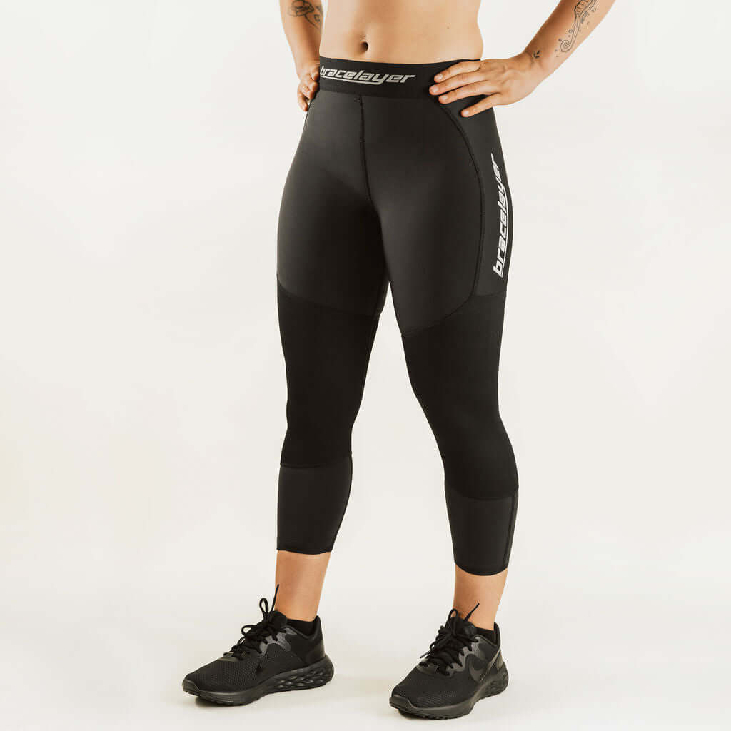 Black 7/8 thermal leggings with leg logo print and flat waistband, women's base layer